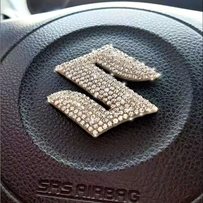 Naklejka dekoracyjna z logo samochodu na kierownicę i diamentami